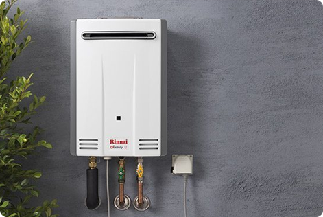 High-Efficiency Outdoor Tankless Water Heater - American Commercial Plumbing LLC